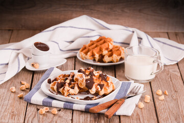 Waffles with chocolate cream and hazelnuts.