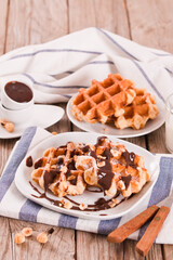 Waffles with chocolate cream and hazelnuts.