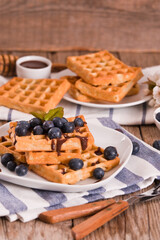 Waffles with blueberries and chocolate cream. 