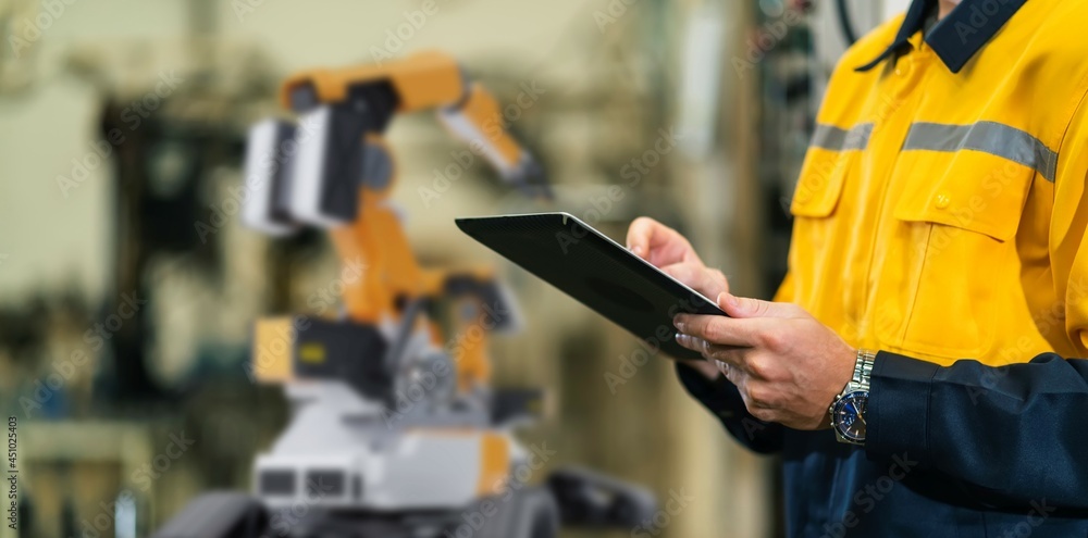 Aufkleber engineer working with robot arm in factory modern production line. future ai artificial intelligence