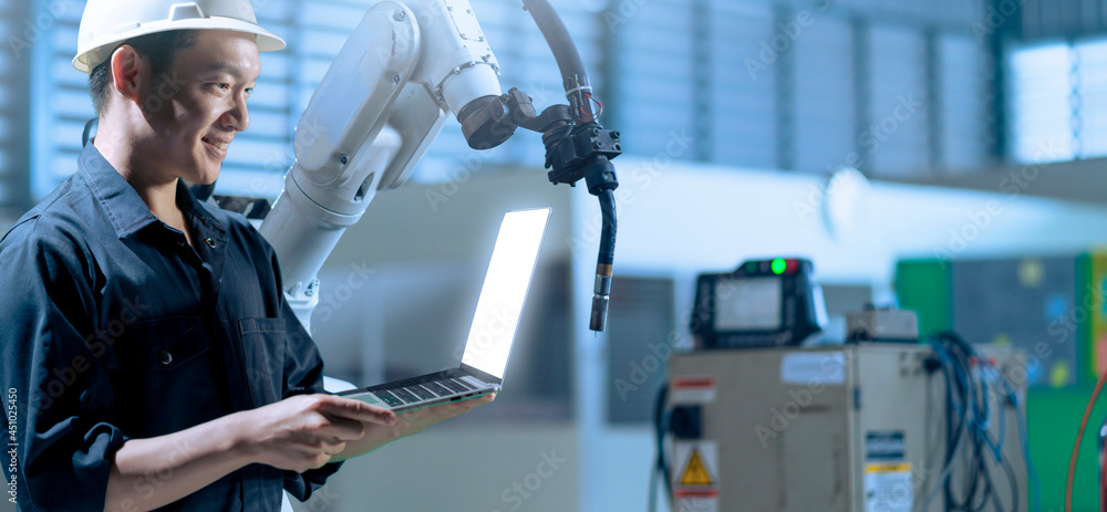 Aufkleber engineer working with robot arm in factory modern production line. future ai artificial intelligence