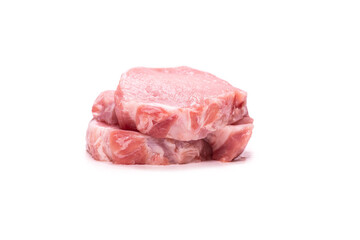 Raw pork pieces isolated on a white background.