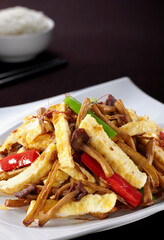 Delicious Chinese dish, fried pork with tea tree mushroom