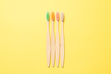 Bamboo toothbrush on a blue background.
