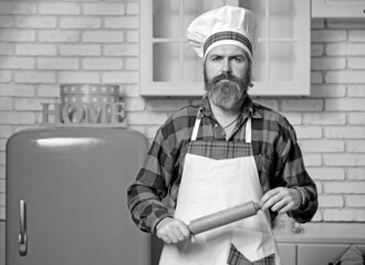 Chef hands cooking Italian pasta on wooden table background.