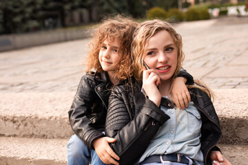 The busy mom with daughter while are walking