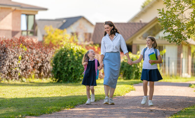 Parent and pupils going to school