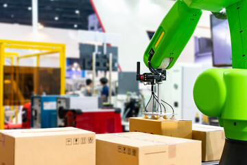 Close up precision robot arm and automatic vacuum or suction cup for pick - place transport paper...