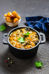 Vegetarian mushroom bourguignon  stew in cast iron pot. Space for text.