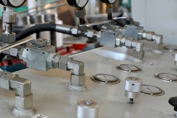 High pressure mechanical shift knobs at hydraulic oil station. Pressure shut-off valves.