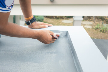 Roof floor or deck painting work consist of painter man or worker person, bristles brush. That...