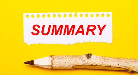 On a bright yellow background, a large wooden pencil and a sheet of torn paper with the text...
