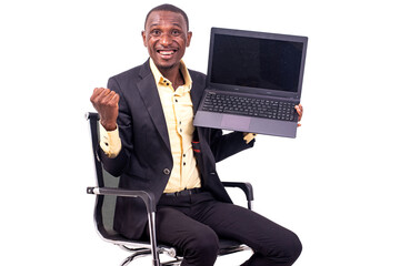 business man sitting holding laptop and making winning gesture smiling.