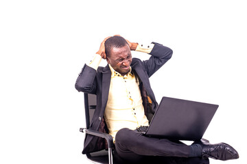 sick businessman sitting on chair suffering from strong pain in his head.