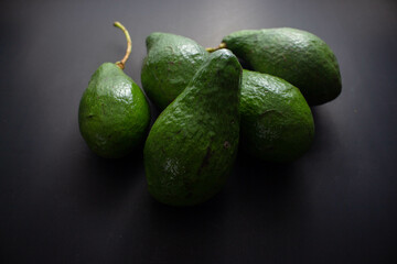 avocado on black table Healthy fruit concept.