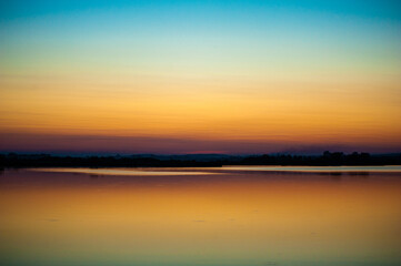 Fototapeta na wymiar Beautiful tranquil sunset on the lake