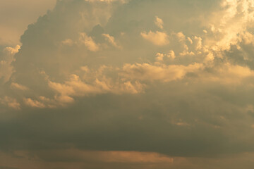 Sky beautiful hot summer background. Detailed clouds at sunrise. Sunny yellow and white sky and beautiful fluffy puffy cloudscape Clean of bugs, and dust.