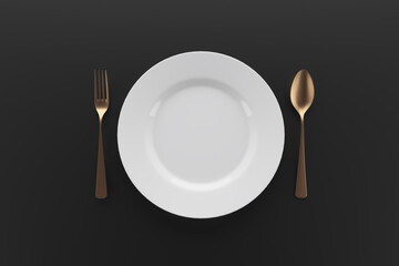 Place setting with plate, gold spoon and fork on black background