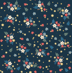 Cute floral pattern in the small flower. Seamless vector texture. Elegant template for fashion prints. Printing with small colorful flowers. Dark blue background. Stock vector for prints on surface.