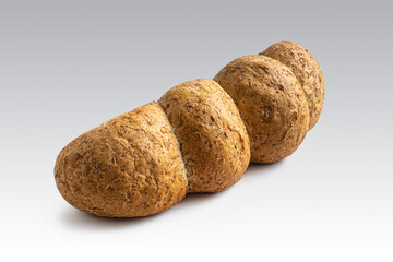 Loaf of wheat-oat bread on a light background
