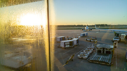 Condensation on windows of airpoir terminal at sunrise, Orlandom International Airport, FL