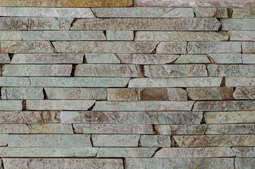 Vintage ceramic tiles. Stone wall. Decorative rock. Masonry.