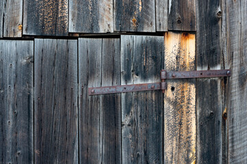 Background of bard wood slats and rusty hinge