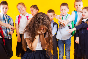 School girl being bullied by classmates. School bullying concept