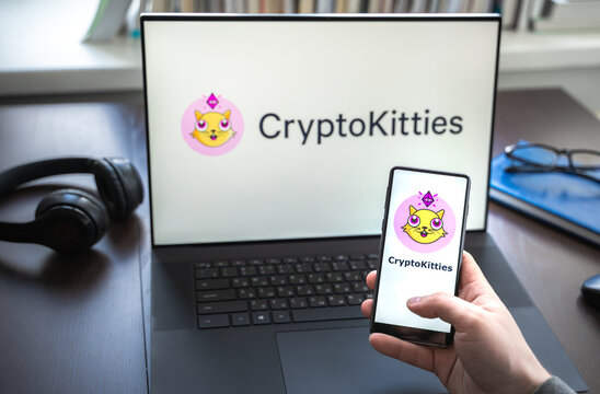 Russia Moscow 30.05.2021.Logo, Screenshot Of Blockchain Nft Ethereum Cryptocurrency Game Cryptokitties In Laptop Screen. Man Playing, Collecting Crypto Kitties. Earning Digital Money At Home