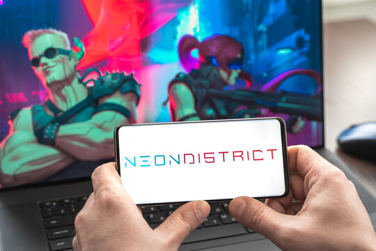 Russia Moscow 30.05.2021.Logo,screenshot of blockchain nft ethereum cryptocurrency kiber punk game Neon District in laptop, mobile phone. Man playing, collecting cards. Earning tokens,digital money