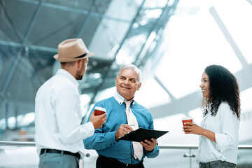 Fototapeta premium multinational group of business people discussing business docum