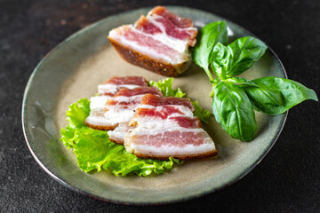 salted lard raw homemade pork fat smoked, dry-cured meal snack on the table copy space food background rustic. top view