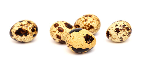 small boiled speckled quail eggs isolated on white 