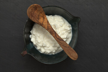 simple still life with cottage cheese in a ceramic bowl
