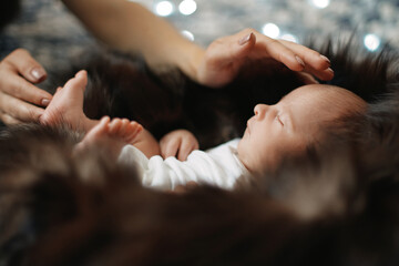 image of a mother gently soothing a newborn baby .