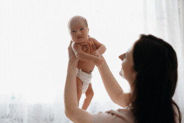 happy mother with a newborn baby in her arms.