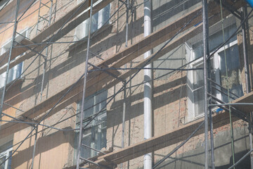 Scaffolding on building house in the city