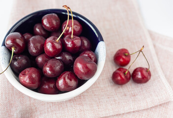 Bowl of ripe cherries. Selrctive focus. Close up. Top view.