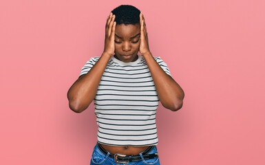 Young african american woman wearing casual clothes suffering from headache desperate and stressed...