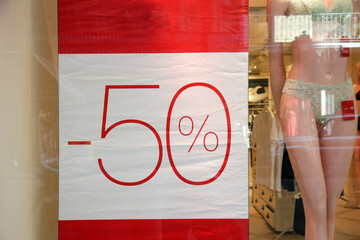 Sale sign at the window shop in the mall	