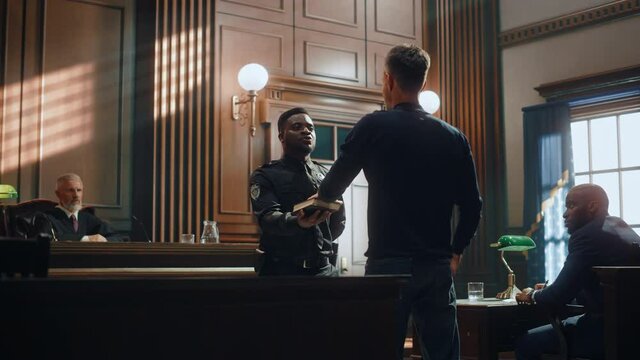 Law and Justice Court Case Witness Solemnly Swears that the Evidence He Shall Give Shall be the Truth and Nothing but the Truth Before Testifying to Lawyers and Judge in Courthouse.