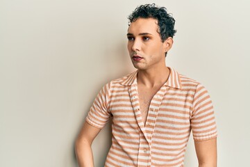 Obraz premium Handsome man wearing make up wearing casual shirt stressed and frustrated with hand on head, surprised and angry face