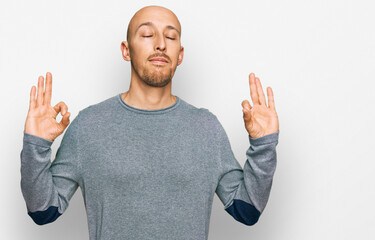 Bald man with beard wearing casual clothes relax and smiling with eyes closed doing meditation gesture with fingers. yoga concept.