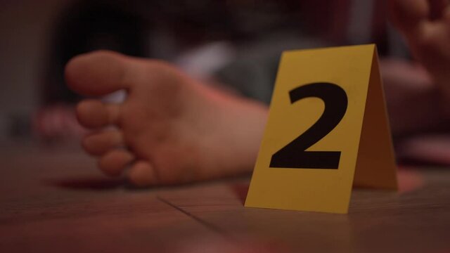 Crime Scene a Foot of a Man Lying Down Dead