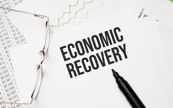 Economic Recovery . Conceptual Background With Chart ,papers, Pen And Glasses