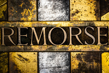 Remorse text on vintage textured copper and gold background