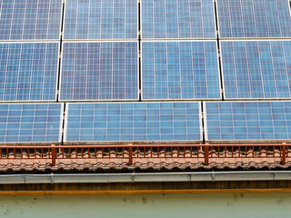 Electric Solar panels with a blue sky reflection. Concept of green energy