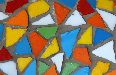 Mosaic pattern close up in retro style. Colorful polygons background.