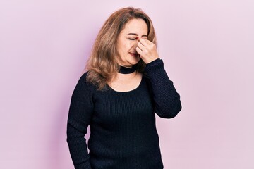 Middle age caucasian woman wearing casual clothes tired rubbing nose and eyes feeling fatigue and headache. stress and frustration concept.