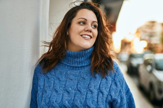 Young irish plus size girl smiling happy standing at the city.